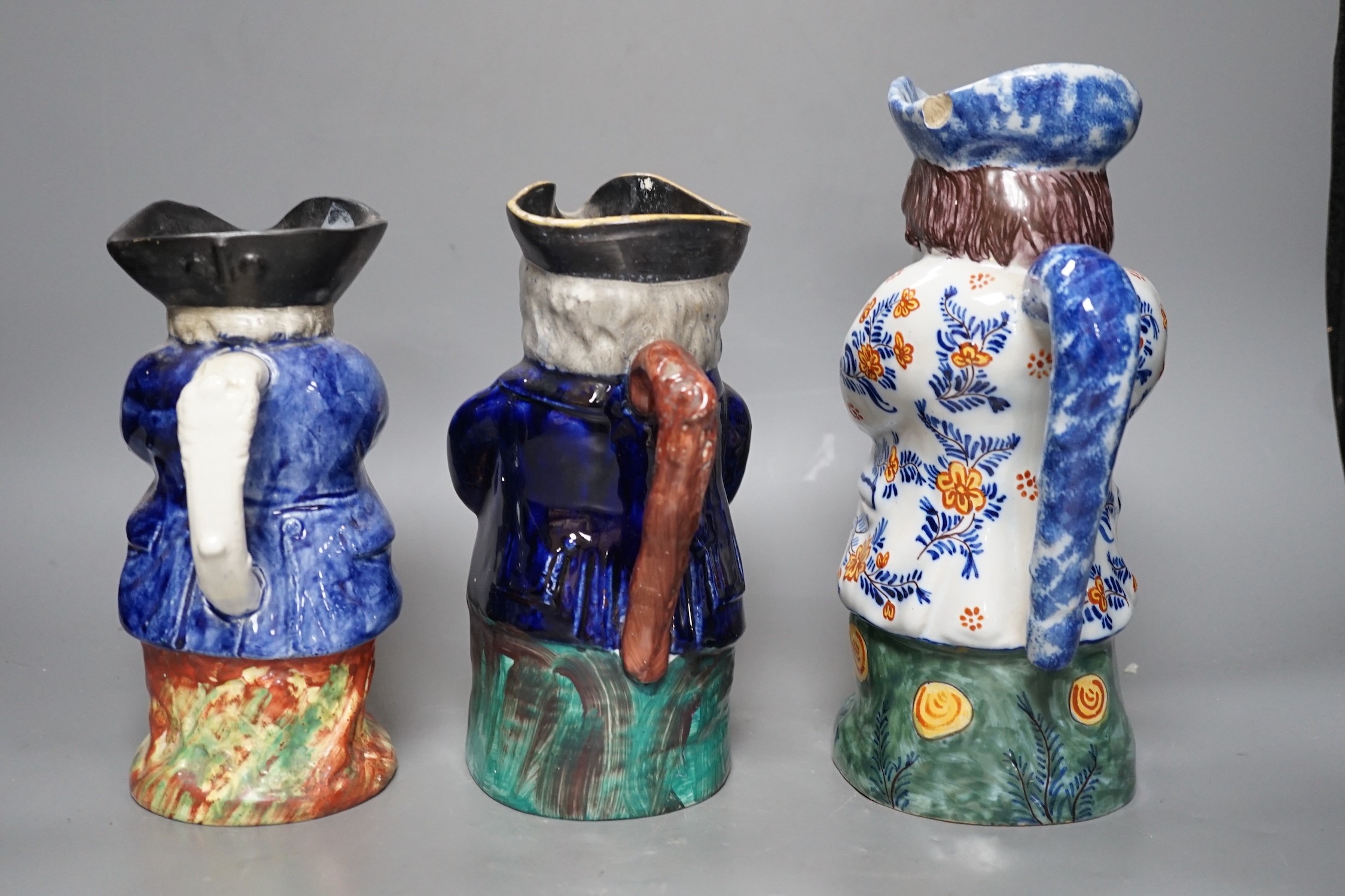 Two Staffordshire 19th century Toby jugs and another later Toby jug, tallest 27cm